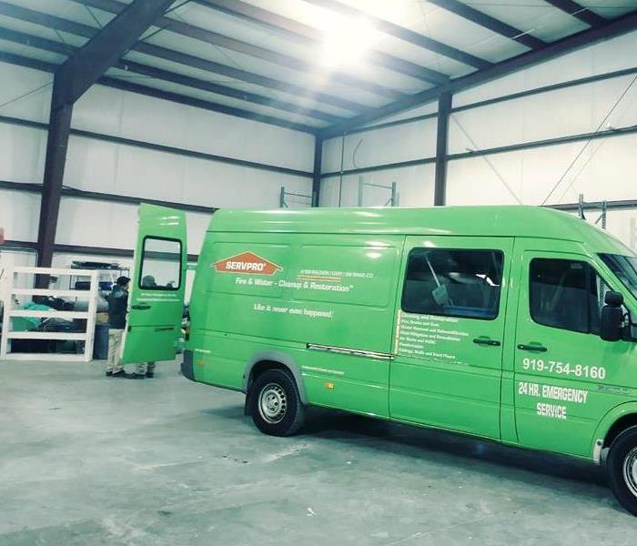 green SERVPRO van in a warehouse