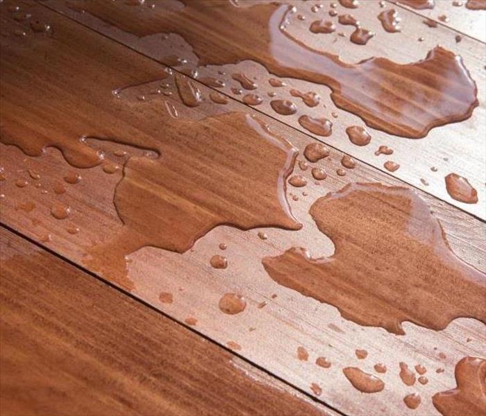 water damaged and wet hardwood flooring