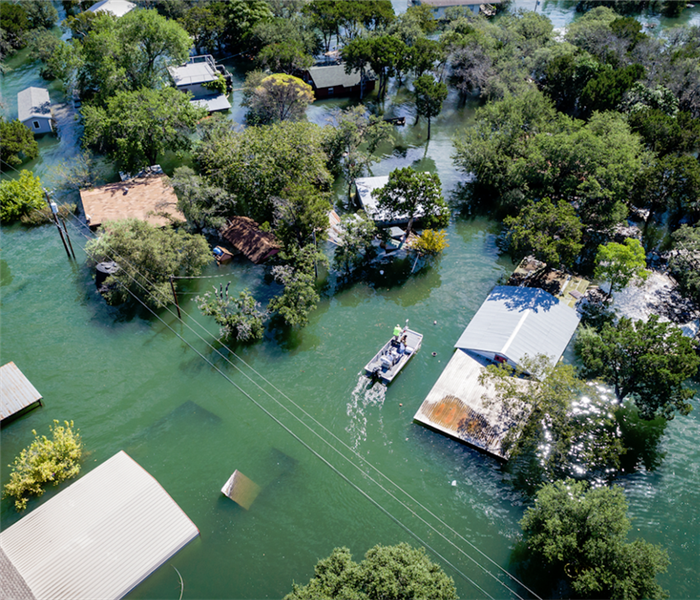 an overhead view of a flooded neighborhood