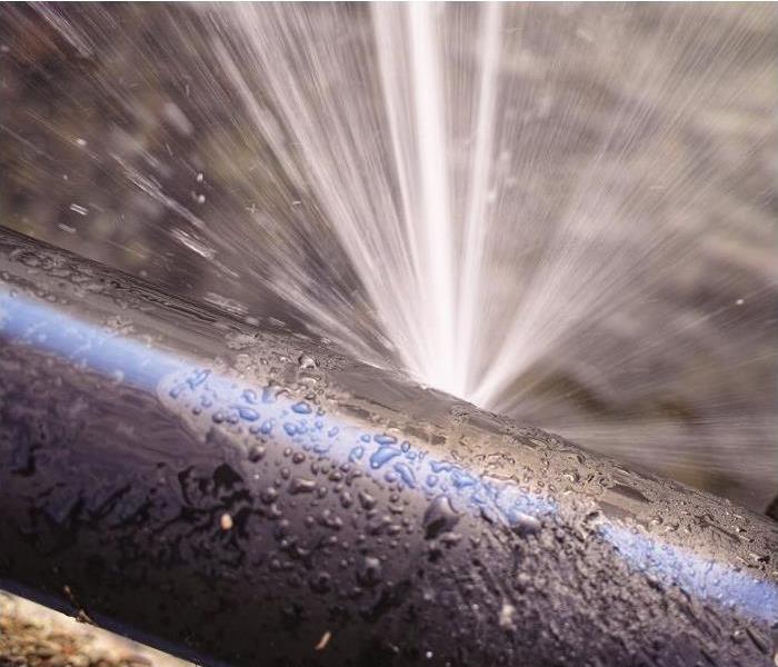 water spewing from a pipe